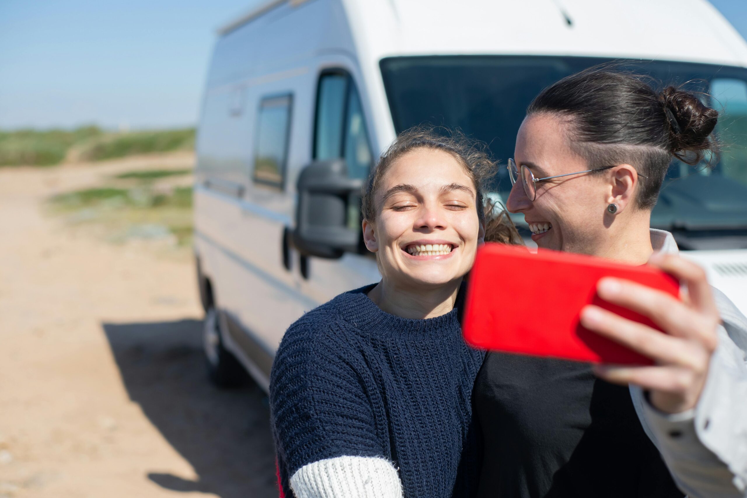 Two international travelers enjoying their USA trip by RV camping.