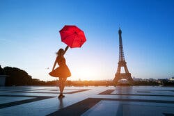 Girl standing in front of Eiffel Tower